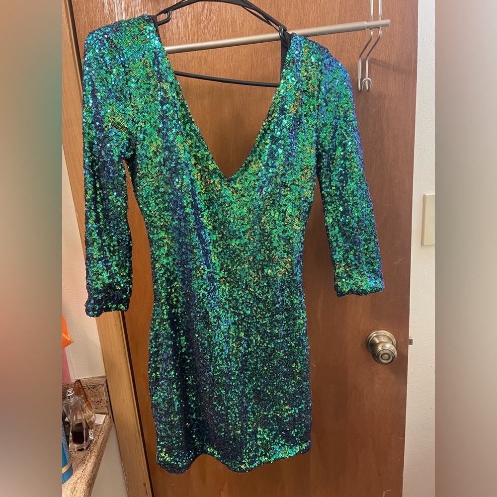 Iridescent blue/green sequined mini dress. Size small, wore once. Zips up back